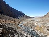 17 Looking Back At Lha Chu Valley From Past Chuku Nyenri Gompa On Mount Kailash Outer Kora From the Chuku (Nyenri) Gompa, it is a quick descent to the Lha Chu and the trail continues up the valley. Here is a view looking back toward the entrance to the Lha Chu Valley.